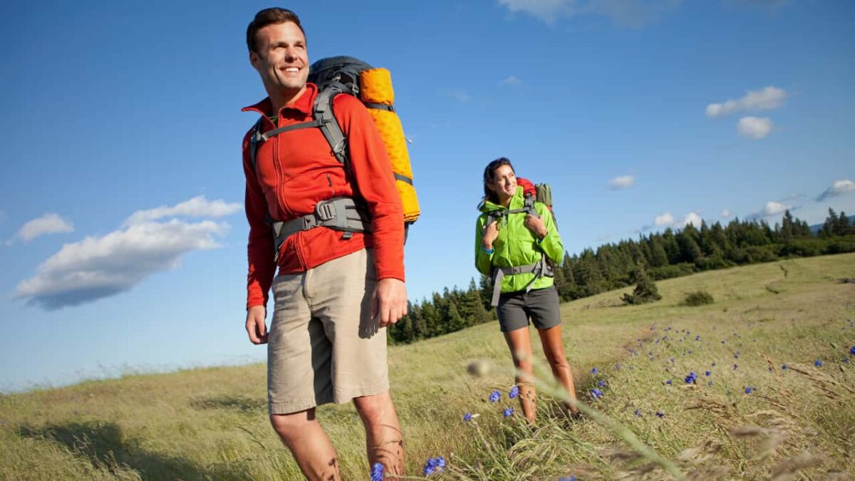 A couple hiking and camping.